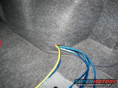 audio_install_trunk_2.jpg Audio System Installation - RCA and Speaker wires fed through opening in right rear wheel well cover
