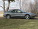 1996 Ford Probe - Side view of a gray 1996 Ford Probe with a spoiler and distinctive five-spoke wheels.