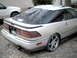 1989 Ford Probe - Rear view of a 1989 Ford Probe, parked outdoors next to a white SUV.