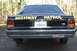 1991 Ford Crown Victoria - Rear view of a black 1991 Ford Crown Victoria, marked as "HIGHWAY PATROL" with a California license plate.