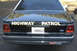 1991 Ford Crown Victoria - 1991 Ford Crown Victoria police car, rear view, showing "HIGHWAY PATROL" text and California license plate.