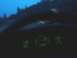 1994 Ford F-150 - The dashboard gauges glow green as the vehicle travels on a road at twilight.