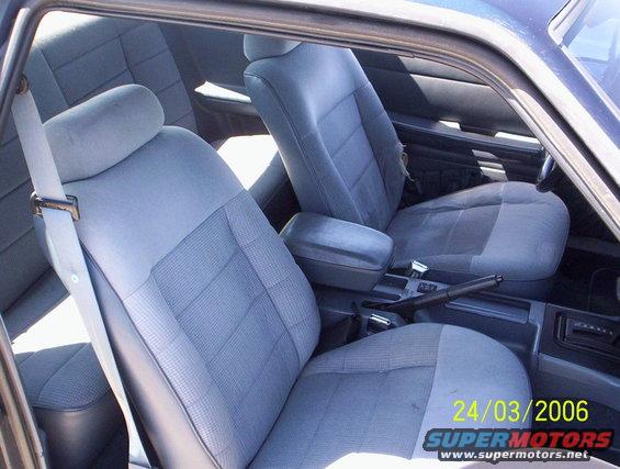 1991 Ford Mustang interior with blue cloth seats and a center console