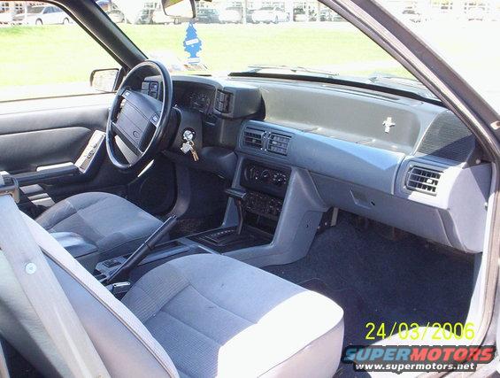 1991 Ford Mustang interior with grey seats and dashboard