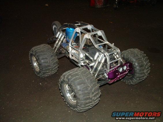RC monster truck with a metal frame, large tires, and a purple front bumper