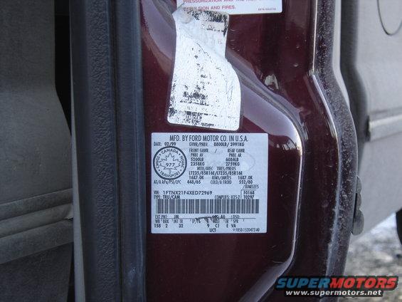 Door sticker on a Ford vehicle, shows manufacturing date 02/99