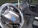 2003 Ford Ranger - The interior of a 2003 Ford Ranger, the steering wheel, dashboard, and driver's side door.