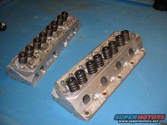 Pair of aluminum engine cylinder heads with springs