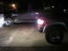 1996 Toyota 4Runner - A dark 1996 Toyota 4Runner is parked next to another SUV at night.