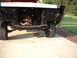 1967 Ford Ranchero - The front end of a vehicle is shown disassembled, revealing the chassis, suspension, and tires.