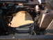 1967 Ford Ranchero - The engine bay frame of a vehicle, showing brake lines and the master cylinder.