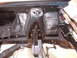 1967 Ford Ranchero - The engine bay of a 1967 Ford Ranchero reveals its internal structure and suspension components.