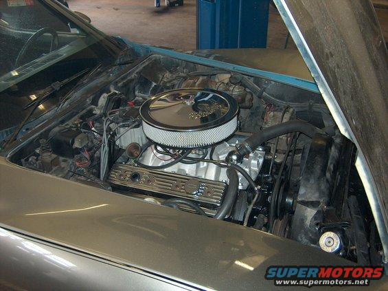 Silver 1979 Chevrolet Corvette engine bay with chrome air cleaner and valve covers