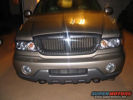 Front view of a tan Lincoln Aviator with a chrome grille