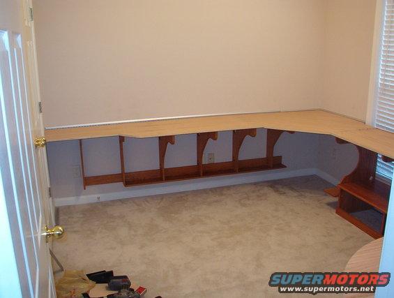 29herdesktest.jpg Just testing here.  I'm using silver aluminum tile edge along the wall to hide the sloppy back edge of the desktop.  It looks vaguely like the brushed stainless/nickel accents we have in the rest of the house & on our storebought furniture.