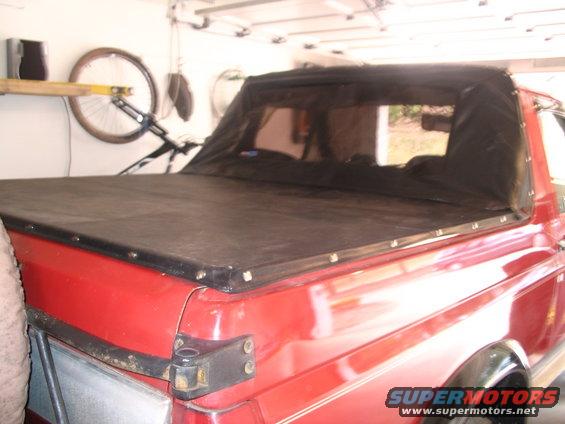 1989 Ford Bronco with black soft tonneau cover, rear view