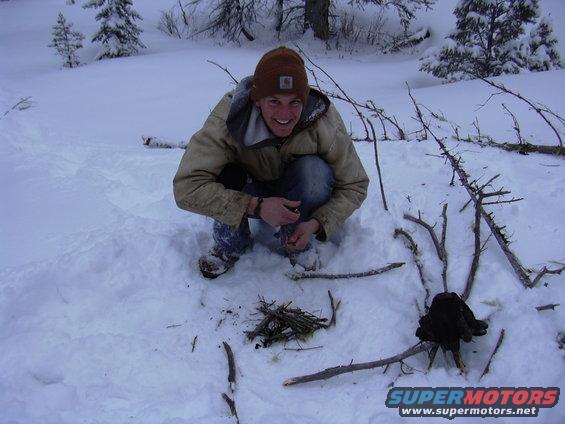 pictures-065.jpg Dodge owner's suite mate trying to start a fire with sticks and trash from the bronco
