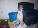 1981 Ford Bronco - A toddler stands on a toy, surrounded by other toys and furniture in a room.