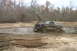 1989 Ford Bronco - Ford Bronco navigating a muddy off-road course.
