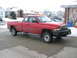 1996 Dodge 2500 - A red 1996 Dodge 2500 pickup truck is parked in a driveway during winter.