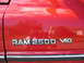 1996 Dodge 2500 - The 'RAM 2500' and 'MAGNUM V10' badges are clearly visible on this red Dodge truck.