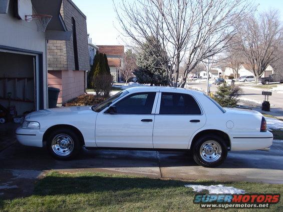 White 2000 Ford Crown Victoria sedan, side view