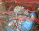 1978 Ford Bronco - The engine bay shows a V8 engine with various hoses and wiring connected.