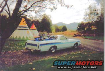 Light blue Ford Ranchero with blue stripe, carrying bicycles on a rack