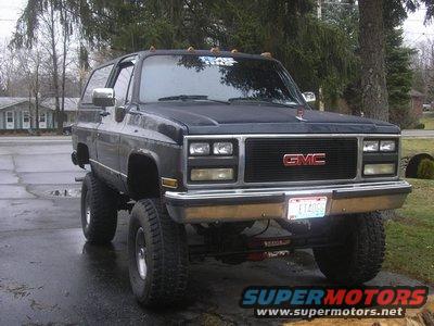 Lifted 1989 GMC K5 Blazer, dark blue, parked outside