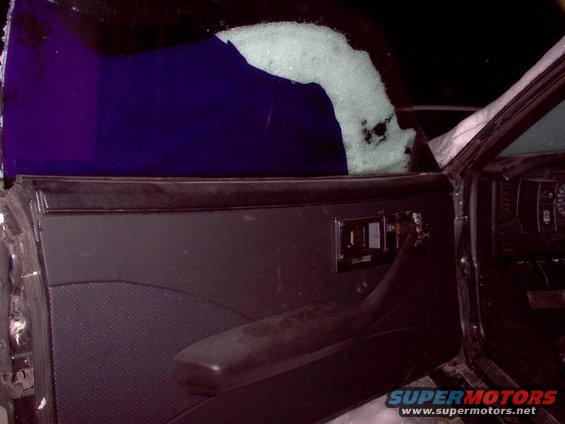 custom 4 piece door panels wrapped in black vinyl and black perforated vinyl in a camaro