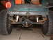 1994 Jeep YJ - The rear suspension and axle of a Jeep are visible, along with a sticker for Cal Poly San Luis Obispo.