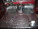 1978 Ford Bronco - Sound deadening material covers the floor of a 1978 Ford Bronco during installation.