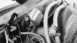 1978 Ford Bronco - Close-up view of engine components, including hoses and electrical wiring, in a black and white photograph.