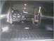 1981 Ford Bronco - The interior of a vehicle shows significant damage and disarray, with the dashboard appearing dismantled.