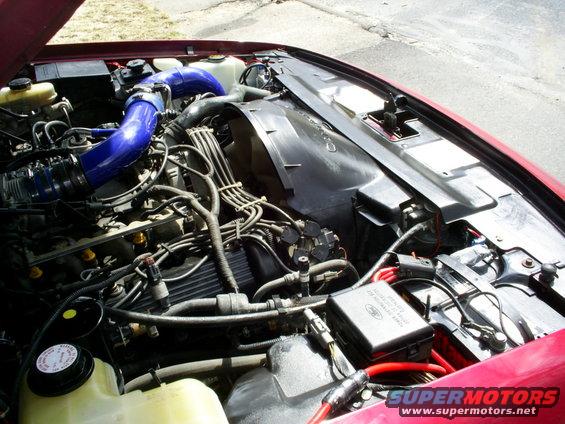 1995 Ford Crown Victoria engine bay with blue intake piping and visible wiring
