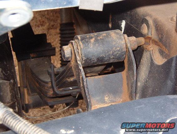 These bolts are installed backward, and they've cut thru the shackle brackets.