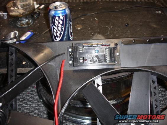 Flex-a-lite fan control module with wiring and a Bud Light can