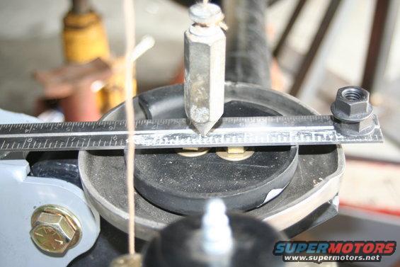 img_1063.jpg this is the pass side - 1 7/8 from front to center - 1 11/16 from rear (as the front will shorten as the arm needs to come up 2 more inches