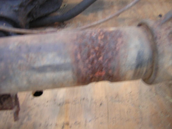 rusted metal pipe with some orange rust spots