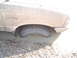 1981 Ford Bronco - A Ford Ranger is stuck in the mud, with its front wheel deep in the mire.