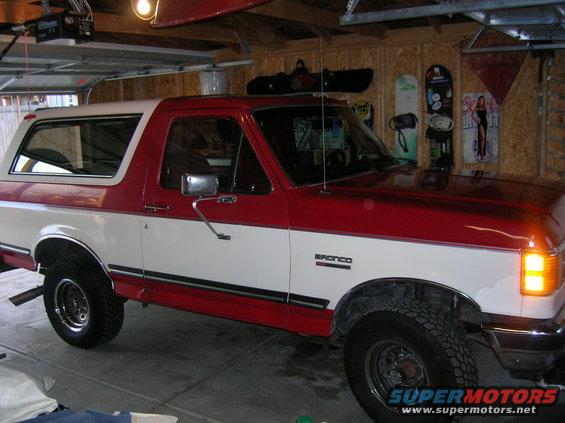 Red and white 1989 Ford Bronco 3/4 front view