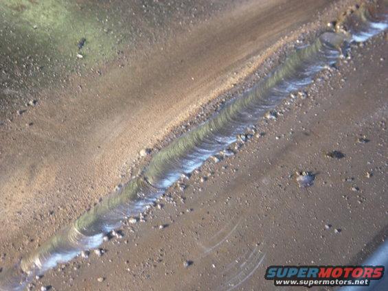 dsc00596.jpg One of the areas I ended up having to grind porosity and run a second pass on.  I ended up deciding to do two passes on most of the run, because I had fairly large gaps and got a little undercut.  Big crater at the end of the section I rewelded, top right, but it's all proud of the surface, and I'm content it will do the job.  I probably wouldn't even need to fillet the backside, but I'm going to anyway.