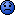 Pixelated blue smiley face with a downturned mouth against a blurred background