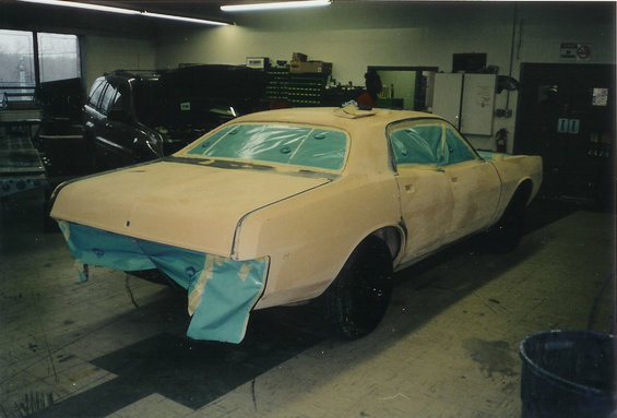 1978 Dodge Monaco in primer, 3/4 front view, covered in plastic sheeting