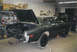 1978 Dodge Monaco - A dark green sedan sits in a garage with its trunk and hood open, undergoing restoration.