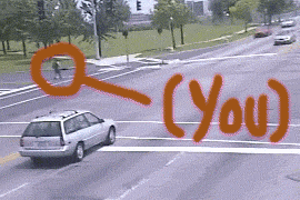 Cars and a person at a street crossing, with an arrow pointing to the person labeled "(You)"