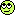 Pixelated green smiley face icon with glasses