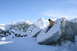 1995 Jeep Cherokee - A person slides down a large ice floe in a snowy landscape.