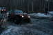 1995 Jeep Cherokee - Two Jeeps navigate a challenging, icy trail in a forest during twilight.
