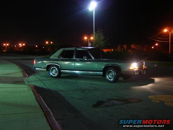 1988 Ford Crown Victoria LTD parked at night under streetlights